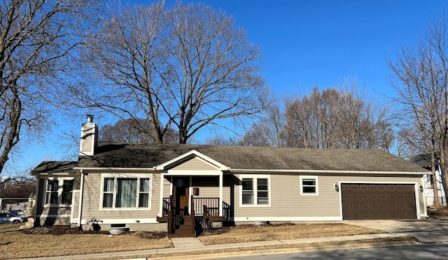 ranch-style home with an attached garage, a chimney, driveway, and roof with shingles