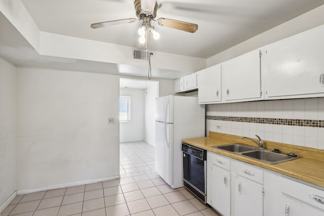 kitchen with visible vents, a sink, black dishwasher, white cabinets, and decorative backsplash