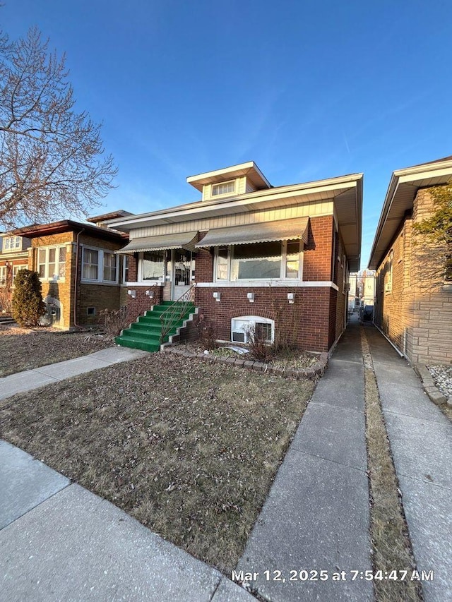 view of front of house with brick siding