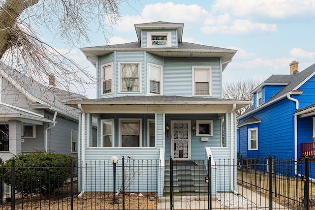 american foursquare style home featuring a fenced front yard, a porch, a shingled roof, and a gate