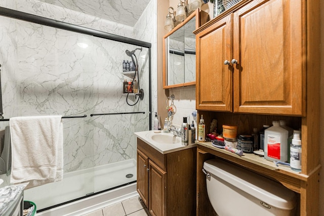 bathroom with a marble finish shower, toilet, and vanity