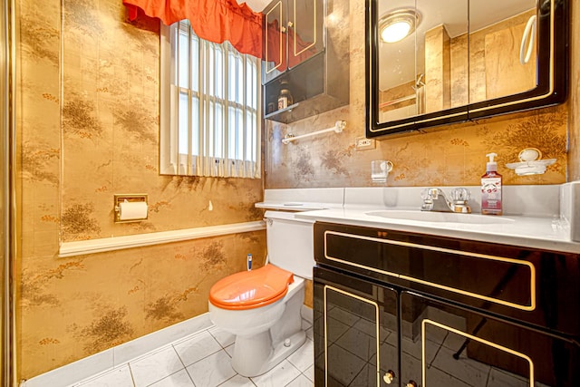 bathroom featuring tile patterned flooring, toilet, wallpapered walls, and vanity