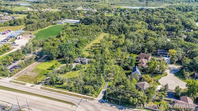 aerial view featuring a water view and a view of trees