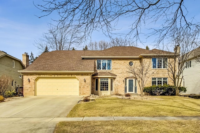 traditional home with a front yard, brick siding, concrete driveway, and an attached garage