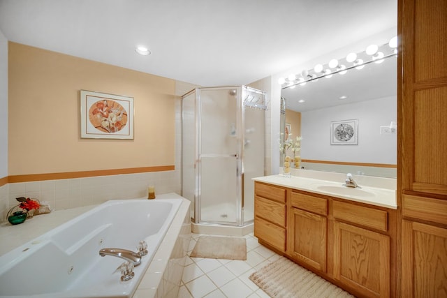 bathroom with vanity, a whirlpool tub, a shower stall, and tile patterned flooring