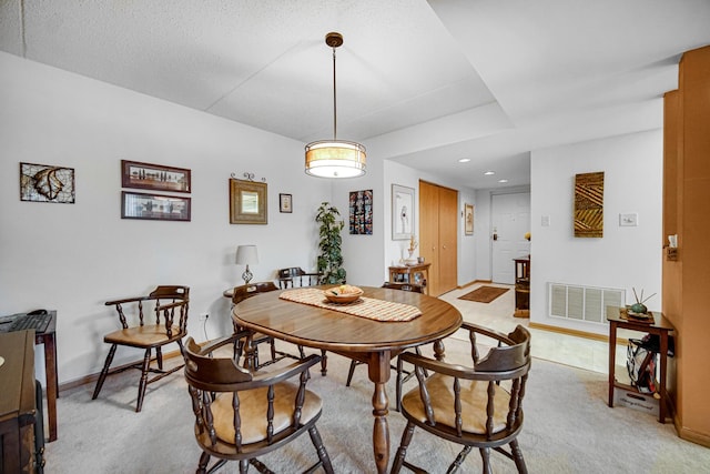 dining area with recessed lighting, baseboards, visible vents, and light carpet