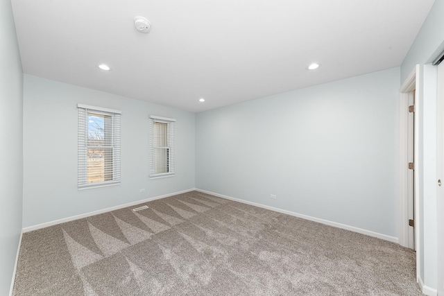 unfurnished room with carpet flooring, recessed lighting, and baseboards