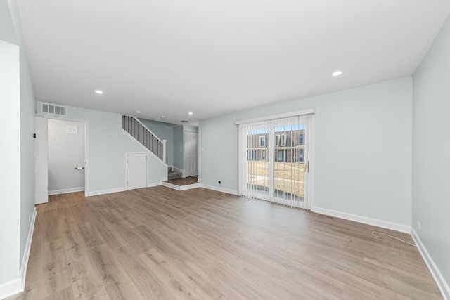 unfurnished living room featuring stairway, baseboards, visible vents, recessed lighting, and light wood-type flooring