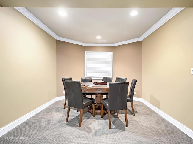 carpeted dining room featuring crown molding, recessed lighting, baseboards, and visible vents