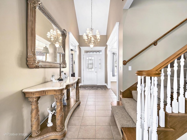 foyer with tile patterned flooring, baseboards, a chandelier, stairway, and lofted ceiling