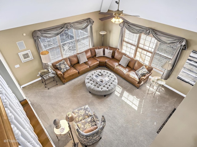 living room with vaulted ceiling with beams, carpet, baseboards, and ceiling fan