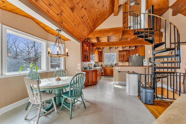 dining area with baseboards, vaulted ceiling with beams, stairs, wood ceiling, and a chandelier