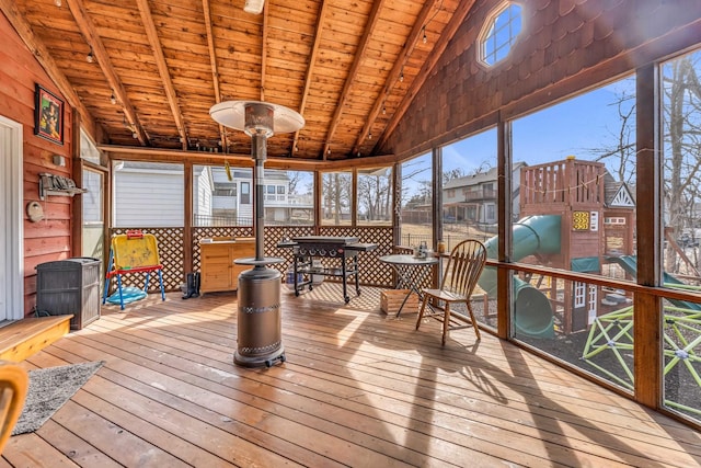 unfurnished sunroom featuring lofted ceiling with beams and wood ceiling