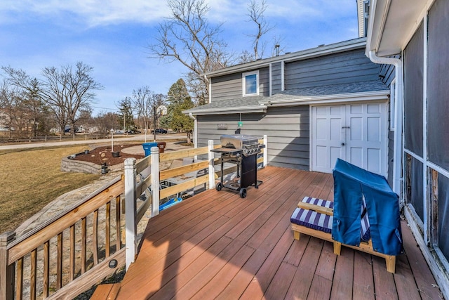 wooden deck featuring area for grilling