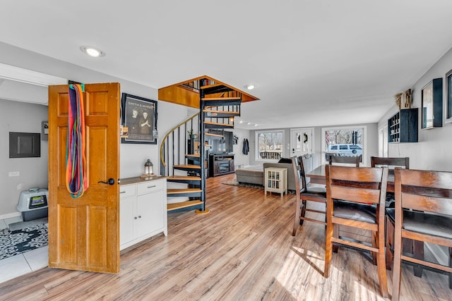 dining area featuring stairway, recessed lighting, light wood-style flooring, and baseboards