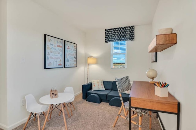 carpeted office featuring baseboards