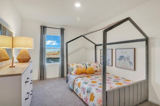 carpeted bedroom featuring recessed lighting and baseboards