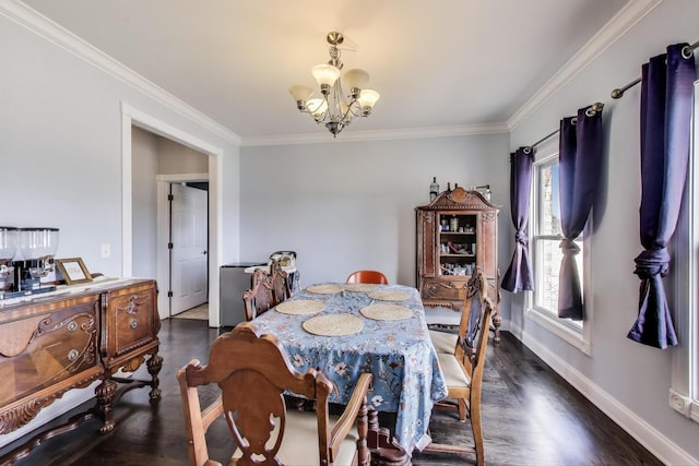 dining space featuring baseboards, a chandelier, dark wood-style flooring, and ornamental molding