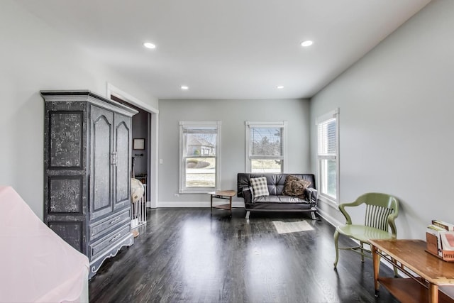 sitting room with recessed lighting, baseboards, and dark wood-style flooring