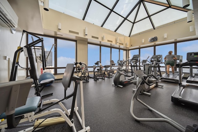 workout area featuring visible vents and a high ceiling