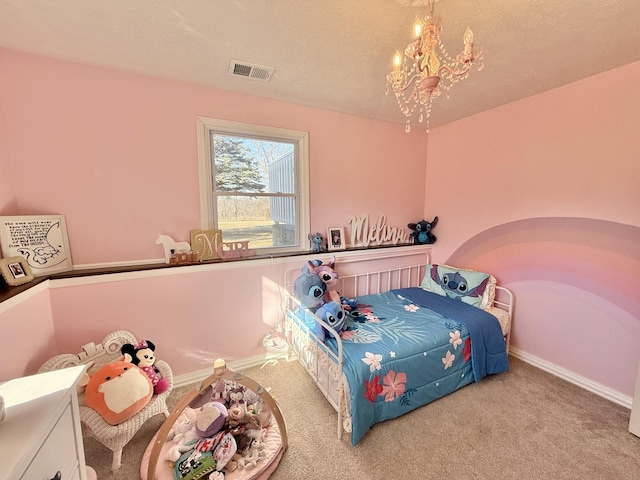 carpeted bedroom with a notable chandelier, baseboards, visible vents, and a textured ceiling