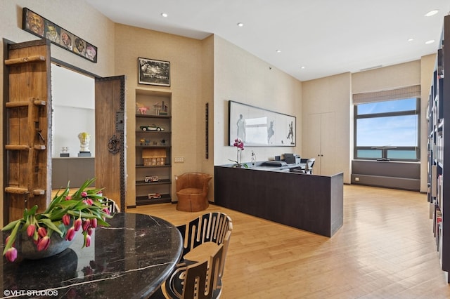 680 N Lake Shore Dr Unit 1602, Chicago, IL 60611 - dining space with light wood finished floors, a towering ceiling, and recessed lighting