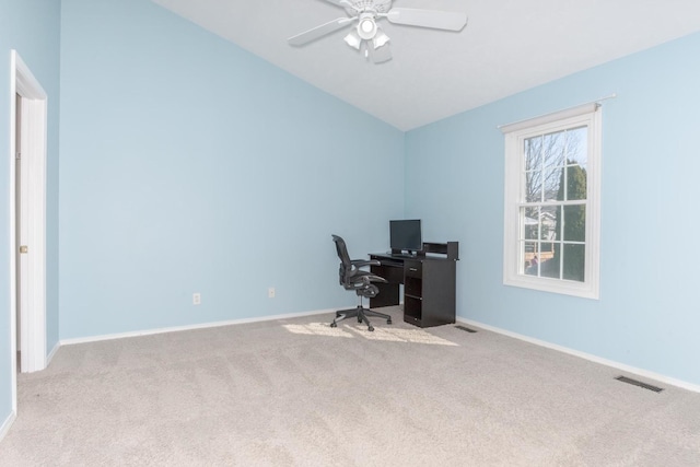 office area featuring carpet flooring, baseboards, visible vents, and ceiling fan