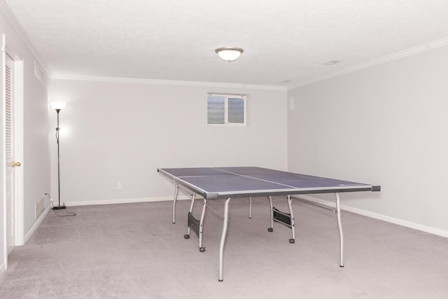 game room with visible vents, baseboards, carpet floors, ornamental molding, and a textured ceiling