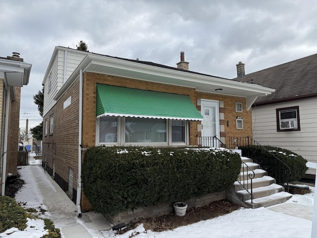 view of front of property featuring brick siding