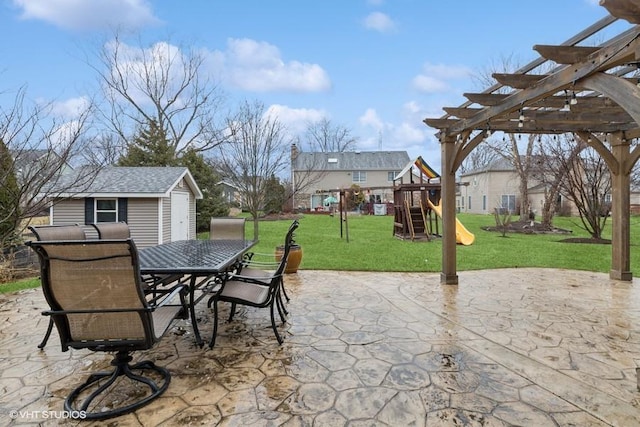 view of patio with outdoor dining area, a pergola, a playground, and an outdoor structure