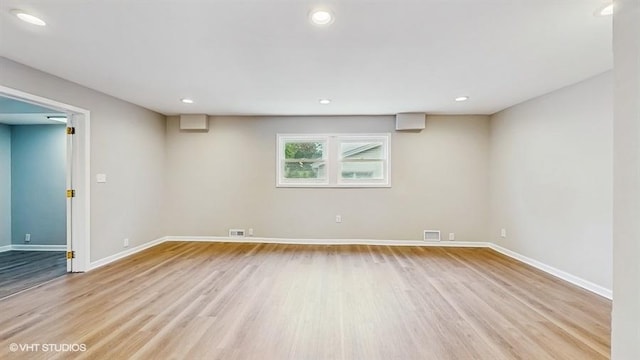 below grade area with wood finished floors, baseboards, and recessed lighting