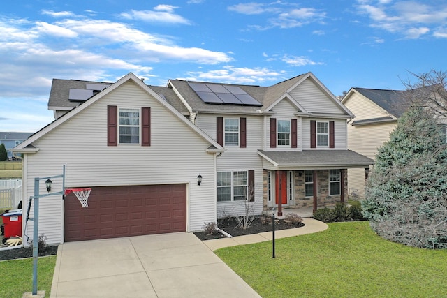 3916 Tallgrass Dr, Champaign, IL 61822 - traditional home with roof mounted solar panels, an attached garage, concrete driveway, and a front lawn