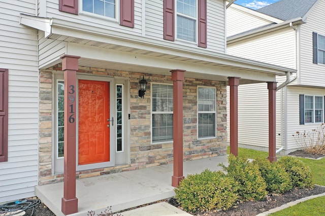 3916 Tallgrass Dr, Champaign, IL 61822 - view of exterior entry featuring a porch and stone siding