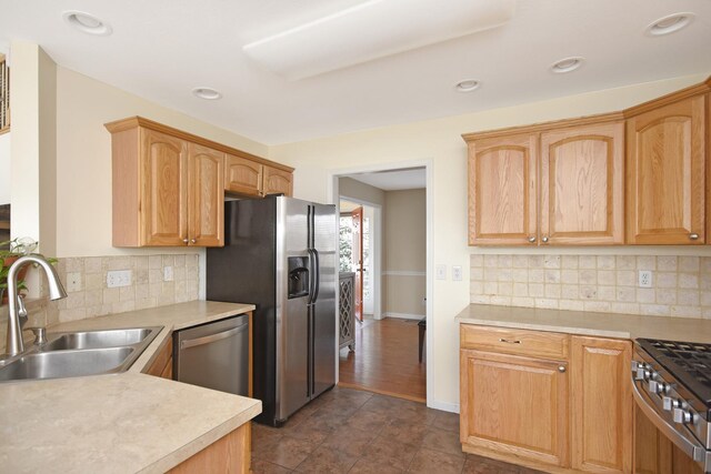 3916 Tallgrass Dr, Champaign, IL 61822 - kitchen with backsplash, a sink, light countertops, stainless steel appliances, and recessed lighting