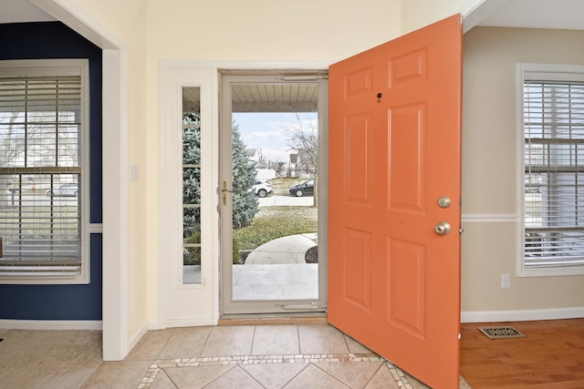 3916 Tallgrass Dr, Champaign, IL 61822 - entrance foyer with light tile patterned flooring, baseboards, and visible vents