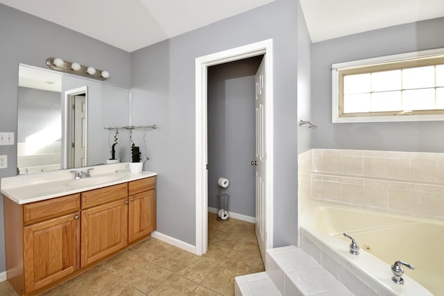 3916 Tallgrass Dr, Champaign, IL 61822 - full bath featuring vanity, tile patterned flooring, baseboards, and a garden tub
