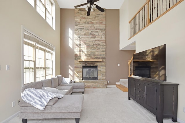 3916 Tallgrass Dr, Champaign, IL 61822 - carpeted living room featuring a ceiling fan, high vaulted ceiling, baseboards, and a fireplace