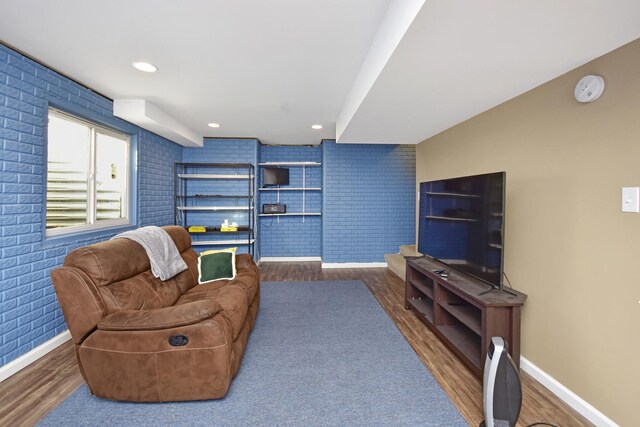 3916 Tallgrass Dr, Champaign, IL 61822 - living room featuring brick wall, baseboards, recessed lighting, and wood finished floors