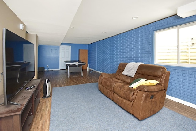 3916 Tallgrass Dr, Champaign, IL 61822 - living room with brick wall, baseboards, and wood finished floors