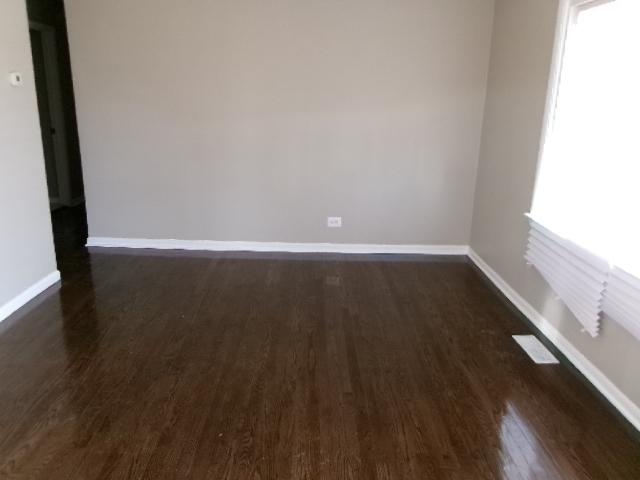14624 Peoria St, Harvey, IL 60426 - empty room featuring baseboards and dark wood-style floors