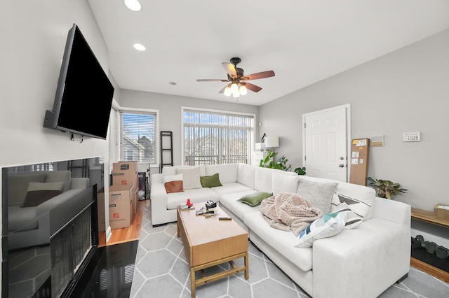 living area with recessed lighting and a ceiling fan