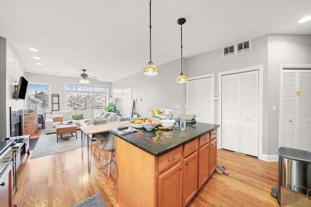 kitchen with a ceiling fan, recessed lighting, light wood-style floors, and visible vents