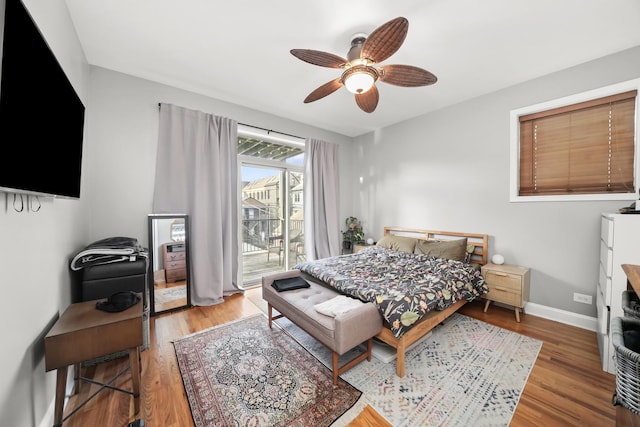 bedroom with access to exterior, a ceiling fan, baseboards, and light wood finished floors