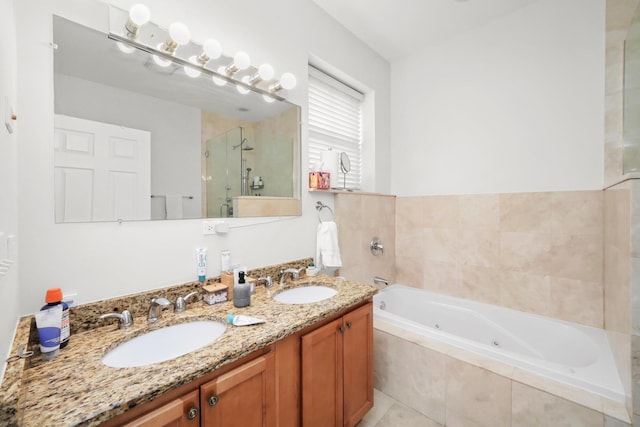 bathroom featuring double vanity, a whirlpool tub, a shower stall, and a sink