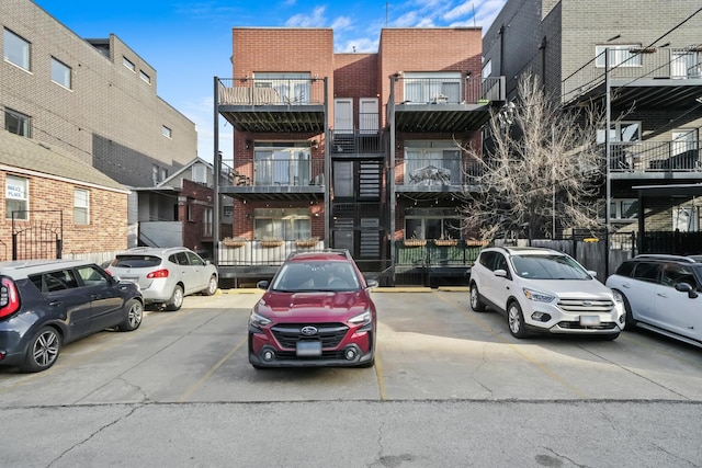 view of building exterior featuring uncovered parking