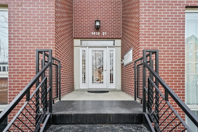 entrance to property with brick siding