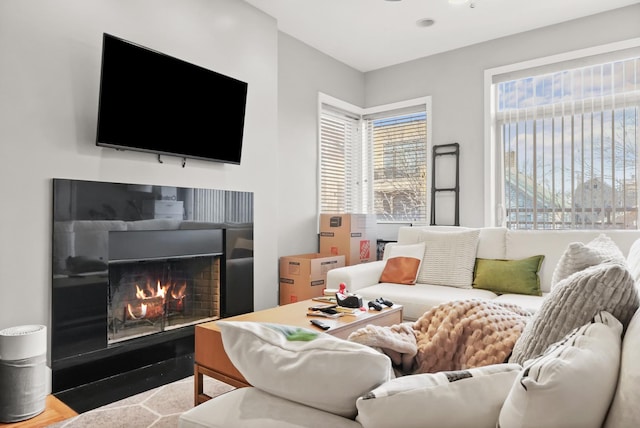 living room with a warm lit fireplace