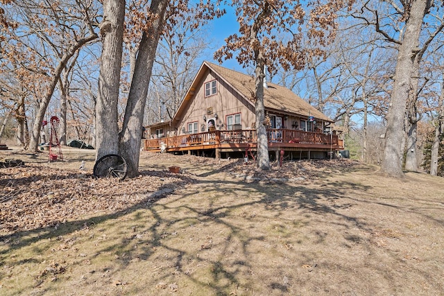 back of property featuring a deck