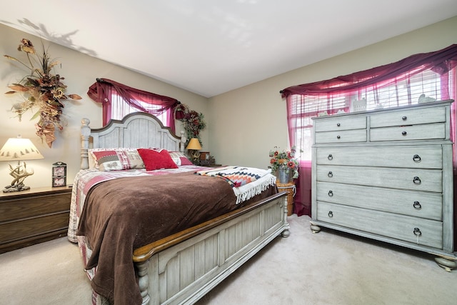 bedroom featuring light carpet