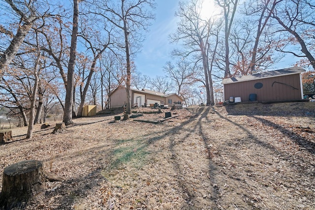 view of yard with an outbuilding and a pole building